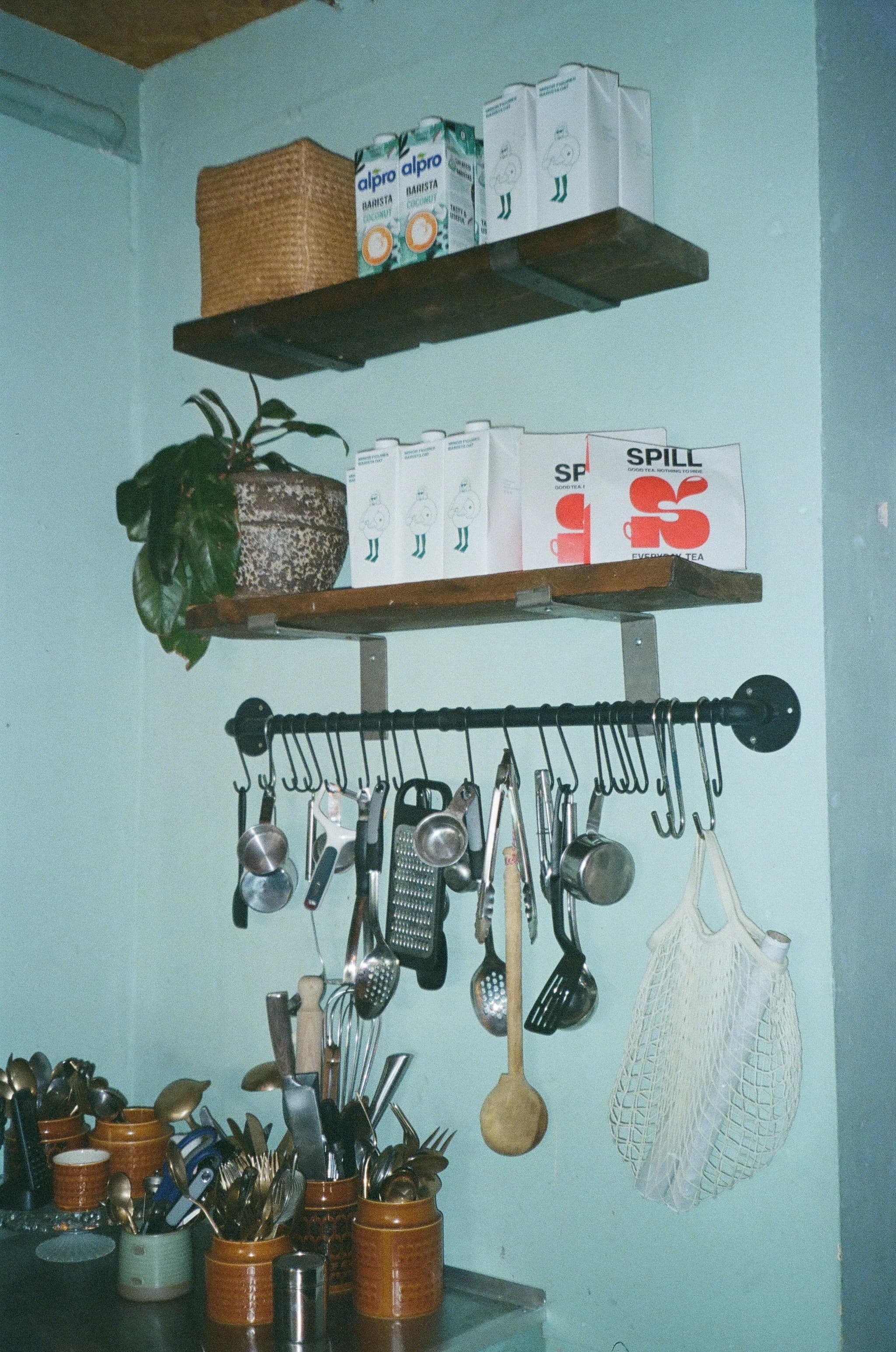 PRANA HOUSE shelves with teas, utensils, and plants